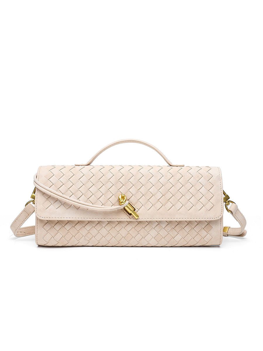 Minimalist beige cream woven vegan leather crossbody baguette bag showcasing a sleek elongated silhouette and premium hardware.