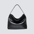 Front view of a black woven vegan leather slouchy tote bag with a top handle