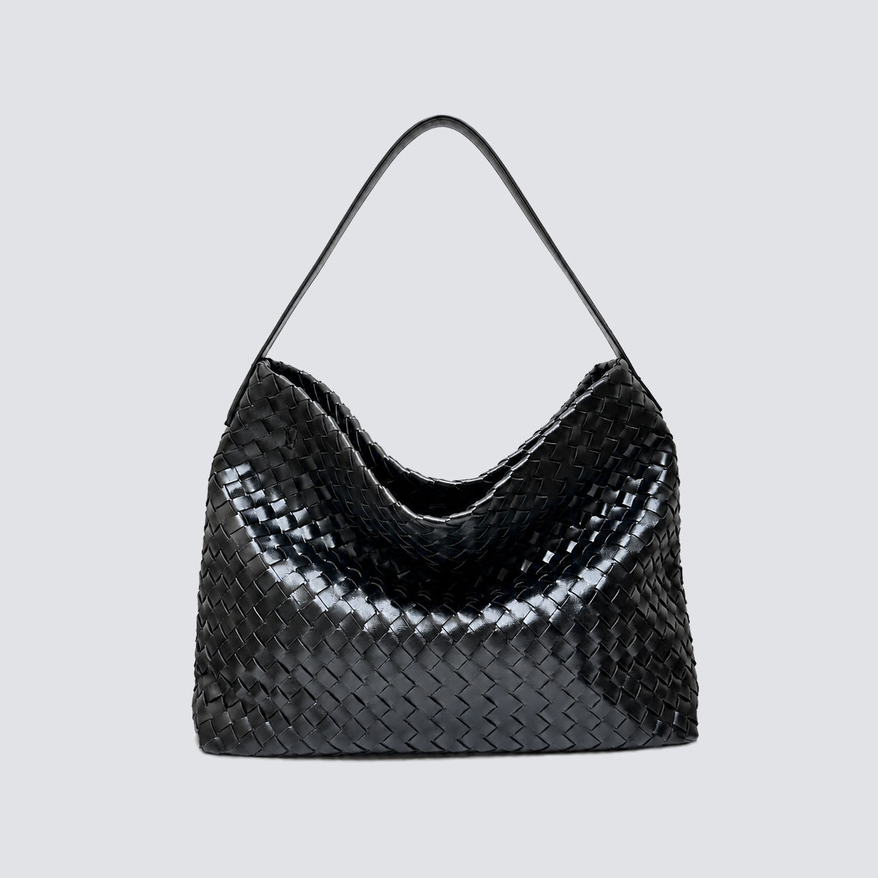 Front view of a black woven vegan leather slouchy tote bag with a top handle