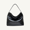 Front view of The Onyx black woven vegan leather slouchy tote bag