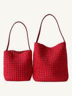 Front view of the bright red genuine leather lattice woven shoulder bags in two versatile everyday sizes.