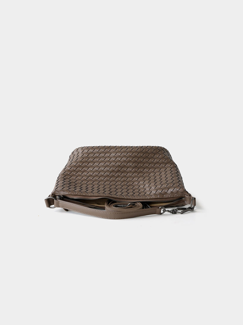Brown woven genuine leather bag flat lay with adjustable strap