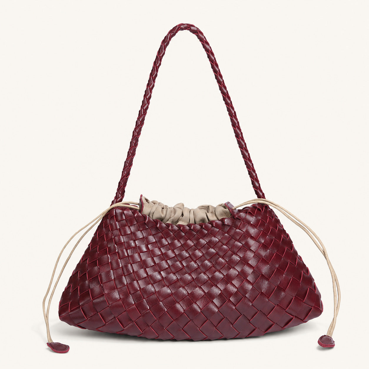 Burgundy woven vegan leather shoulder bag with textured curved body