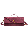 Elegant burgundy red woven vegan leather baguette clutch bag featuring a signature gold knot clasp and top handle.