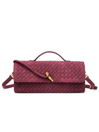 Elegant burgundy red woven vegan leather baguette clutch bag featuring a signature gold knot clasp and top handle.
