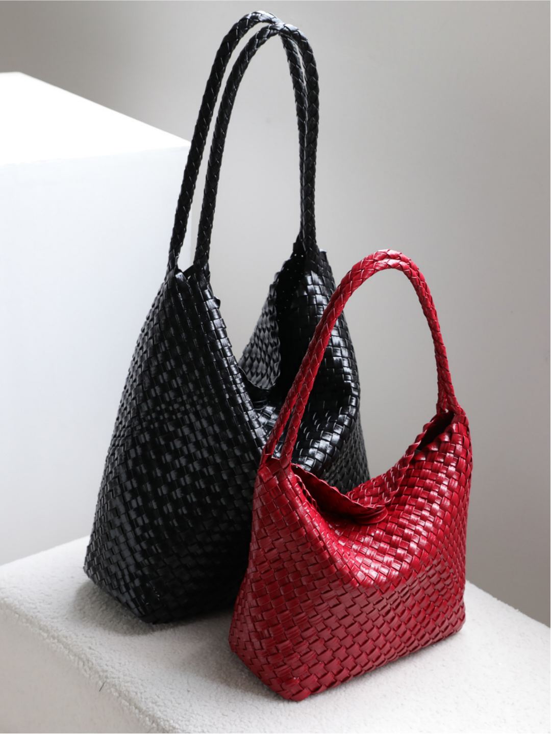 Black and red chunky woven vegan leather tote bags