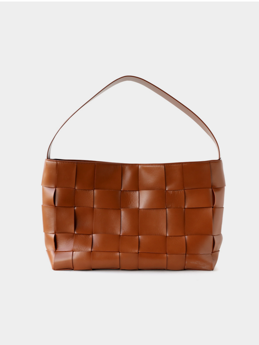 Clean front view of the classic brown genuine leather woven shoulder bag featuring a comfortable wide strap.