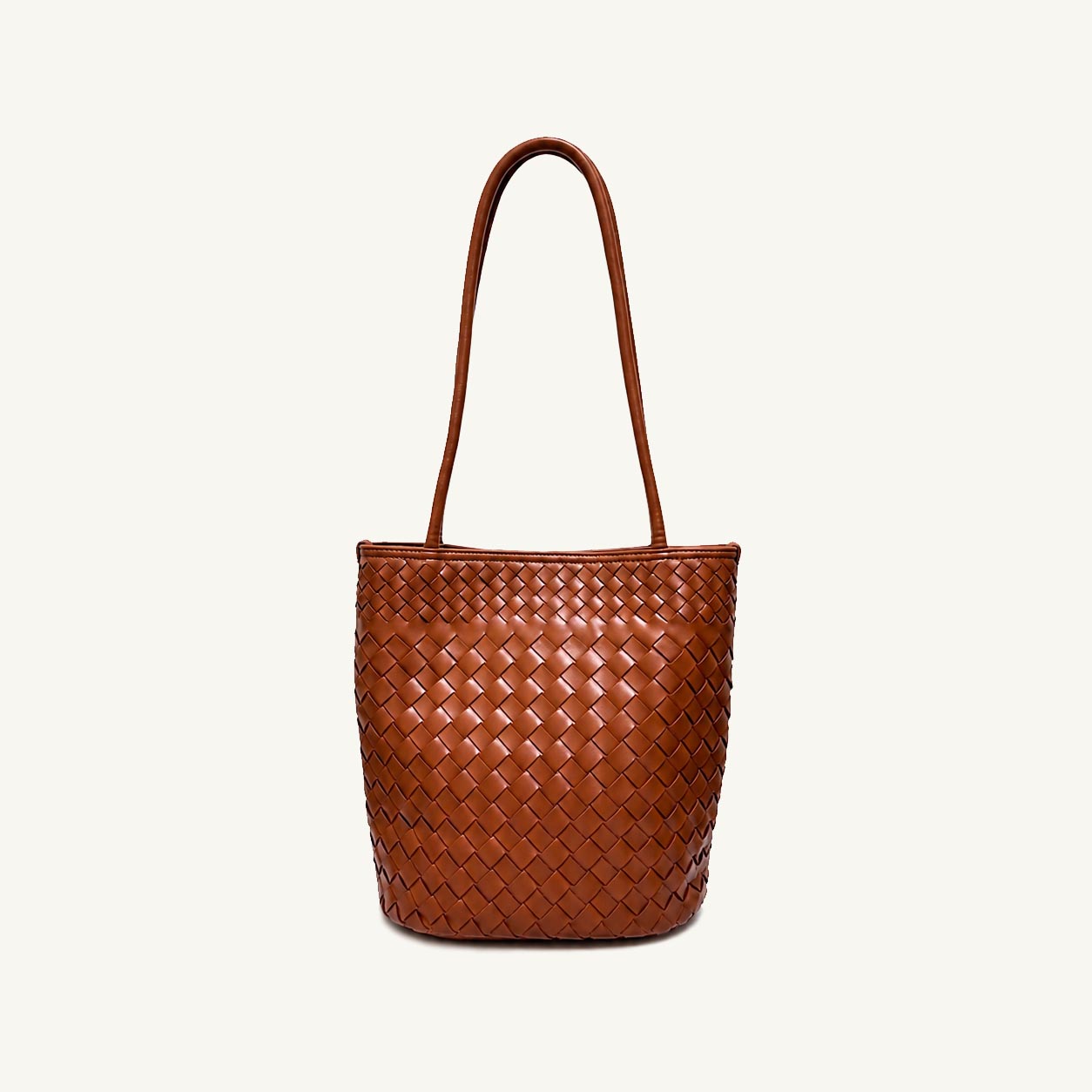 Cognac woven vegan leather bucket bag with single top handle, front view