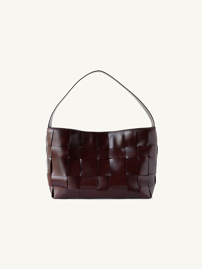 Front view of the elegant dark burgundy wide-weave genuine leather shoulder tote bag with a sleek minimalist finish.