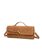 Elegant tan woven vegan leather shoulder bag displaying its intricate flat weave texture and structured elongated silhouette.