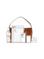 Visual capacity guide for the genuine leather woven tote bag, easily fitting a 13-inch MacBook, iPad, and daily essentials for work.