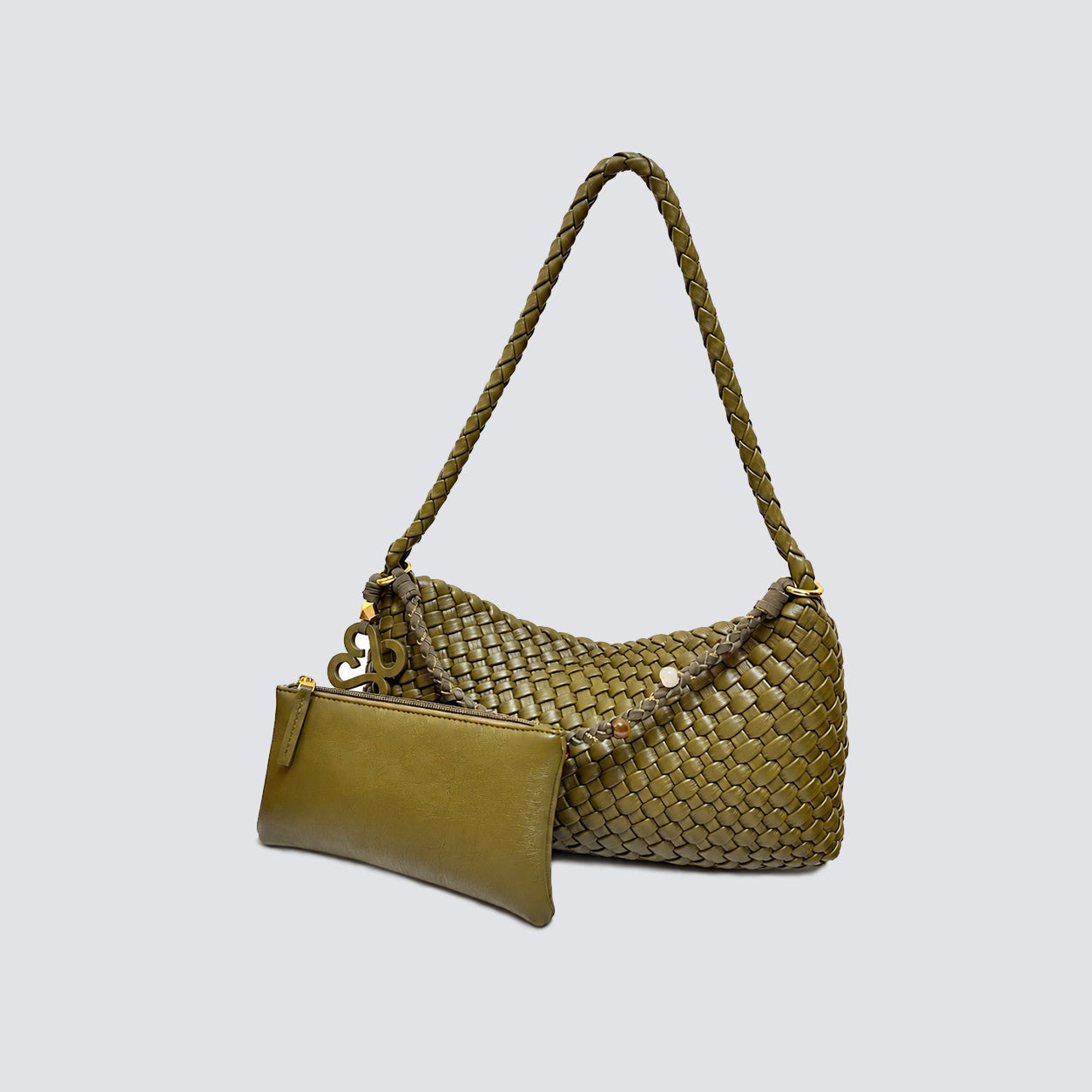 live green woven shoulder bag displayed next to its matching vegan leather zip pouch