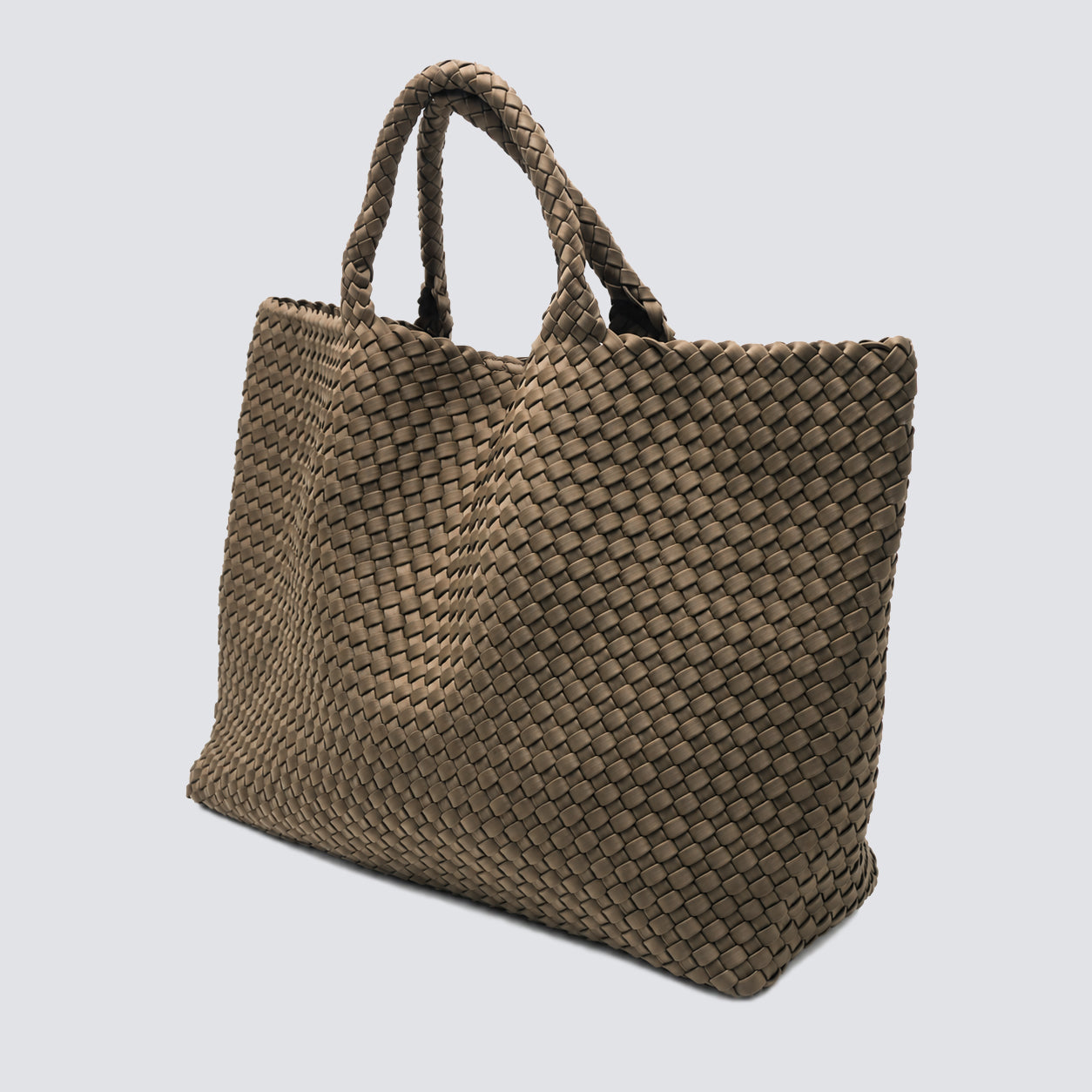Angled view of the spacious taupe woven shopper bag showing its large capacity