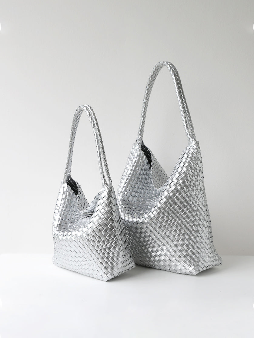 Metallic silver woven vegan leather tote bag shown in size options