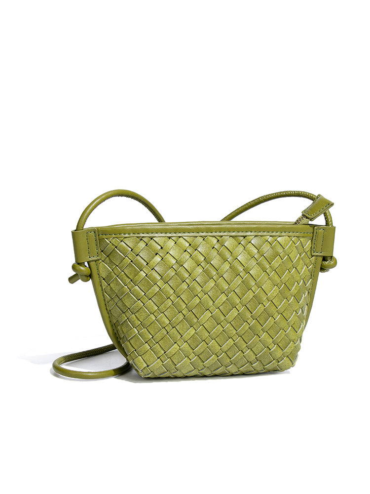 Angled view of the mini olive green woven vegan leather shoulder purse highlighting its premium matte texture and secure top zipper.