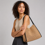 Model styling the versatile woven paper straw tote bag on her shoulder