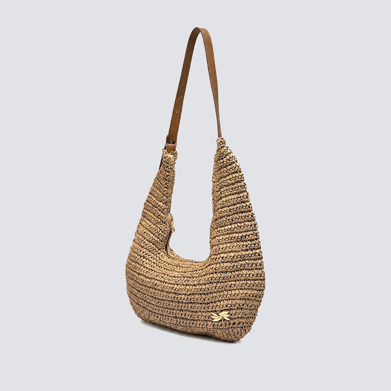 Angled view of the woven summer shoulder bag showing its relaxed silhouette
