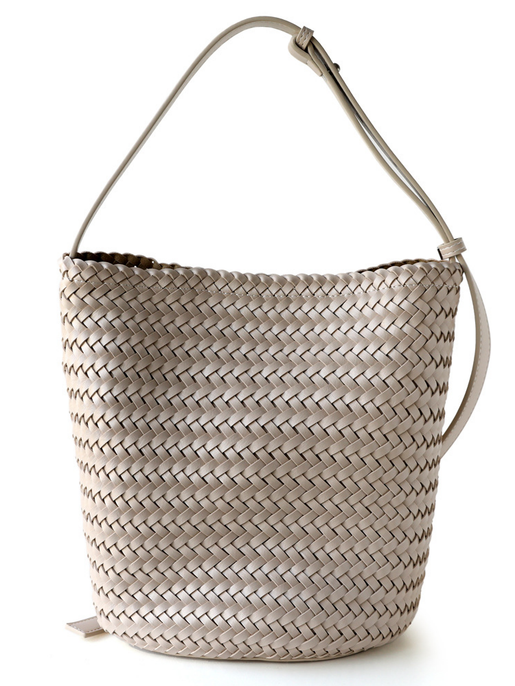 Off-white handwoven vegan leather tote bag with an adjustable strap, perfect for versatile everyday styling.