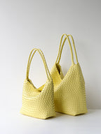 Pale yellow woven vegan leather tote bag shown in size options