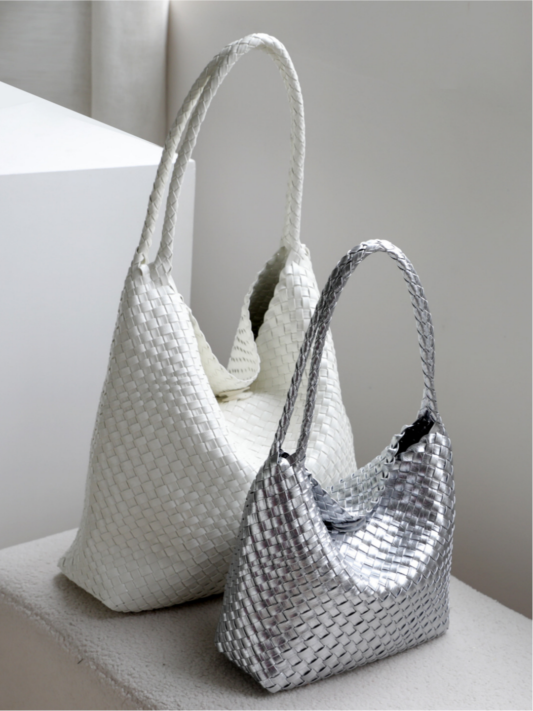White and metallic silver woven vegan leather shoulder bags