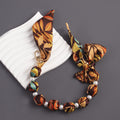 Brown autumn leaf print silk scarf bag charm with faux pearl beads