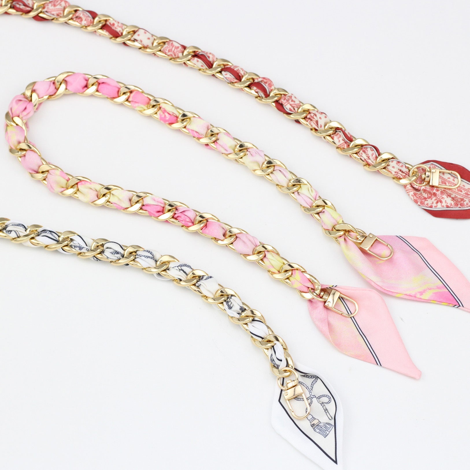 Collection of silk woven replacement bag chains in pink and red patterns
