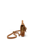 Side profile of the slim woven vegan leather crossbody bag highlighting its elegant minimalist 4cm depth.