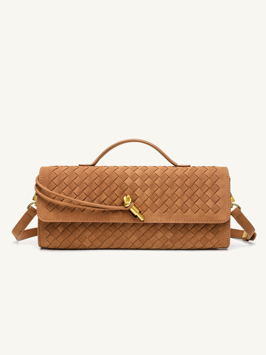 Front view of the tan woven vegan leather baguette bag, featuring a chic gold knot clasp and an elegant top handle.