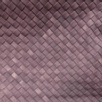 Close-up of the woven vegan leather texture on the aubergine colorway of The Onyx shoulder bag