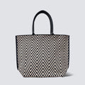 Black and brown chevron knit tote bag with black handles on a simple product background