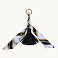 Black and white equestrian print scarf bow bag charm with black vegan leather tassel