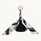 Black and white equestrian print scarf bow bag charm with black vegan leather tassel