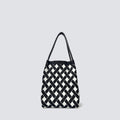 Black and white checkerboard knit tote bag on a simple product background