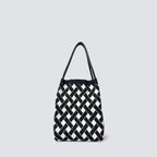 Black and white checkerboard knit tote bag on a simple product background