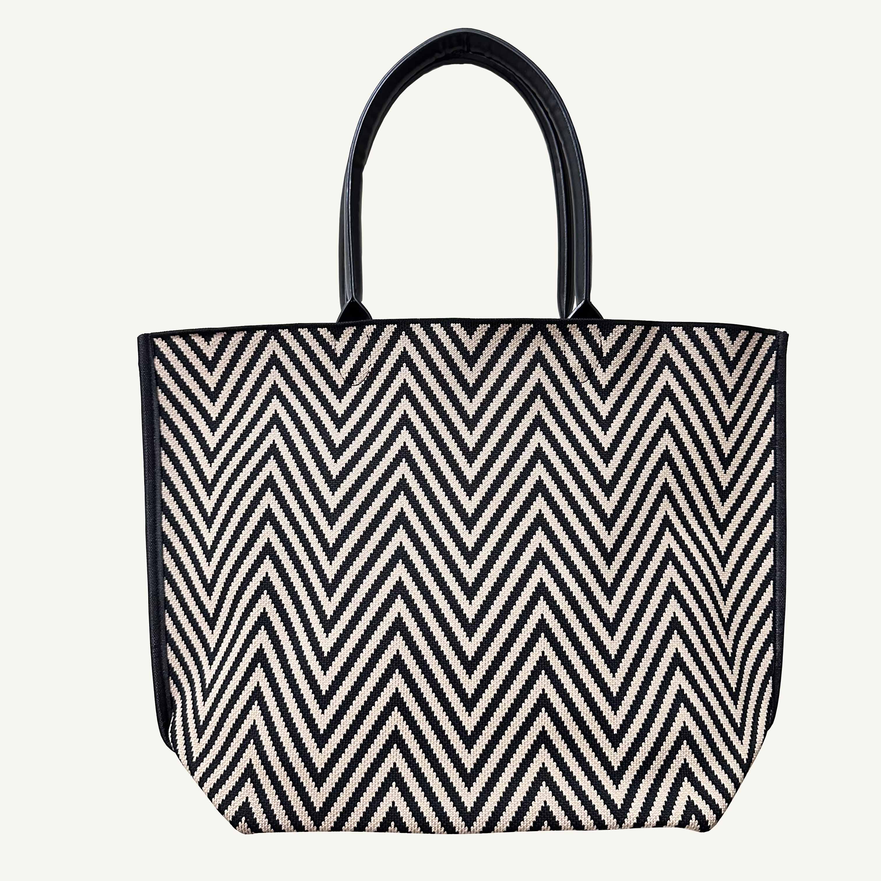 Black and brown chevron knit tote bag with black handles, front view