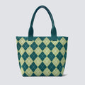 Green argyle knit tote bag with matching handles on a simple product background