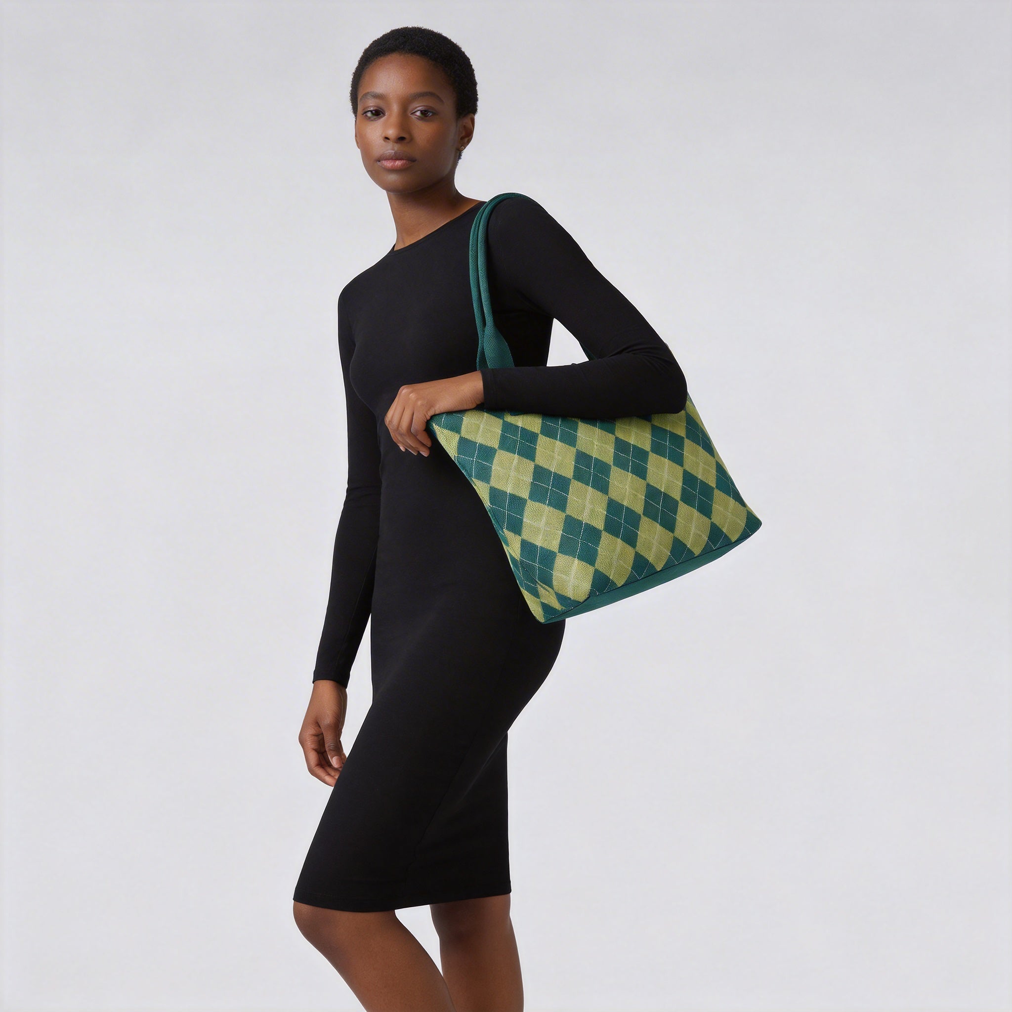 Green argyle knit tote bag styled over the shoulder with a casual outfit