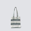 Green and white grid knit mini tote bag on a simple product background