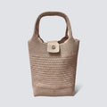 Natural woven mini beach tote bag with top handles on a simple product background