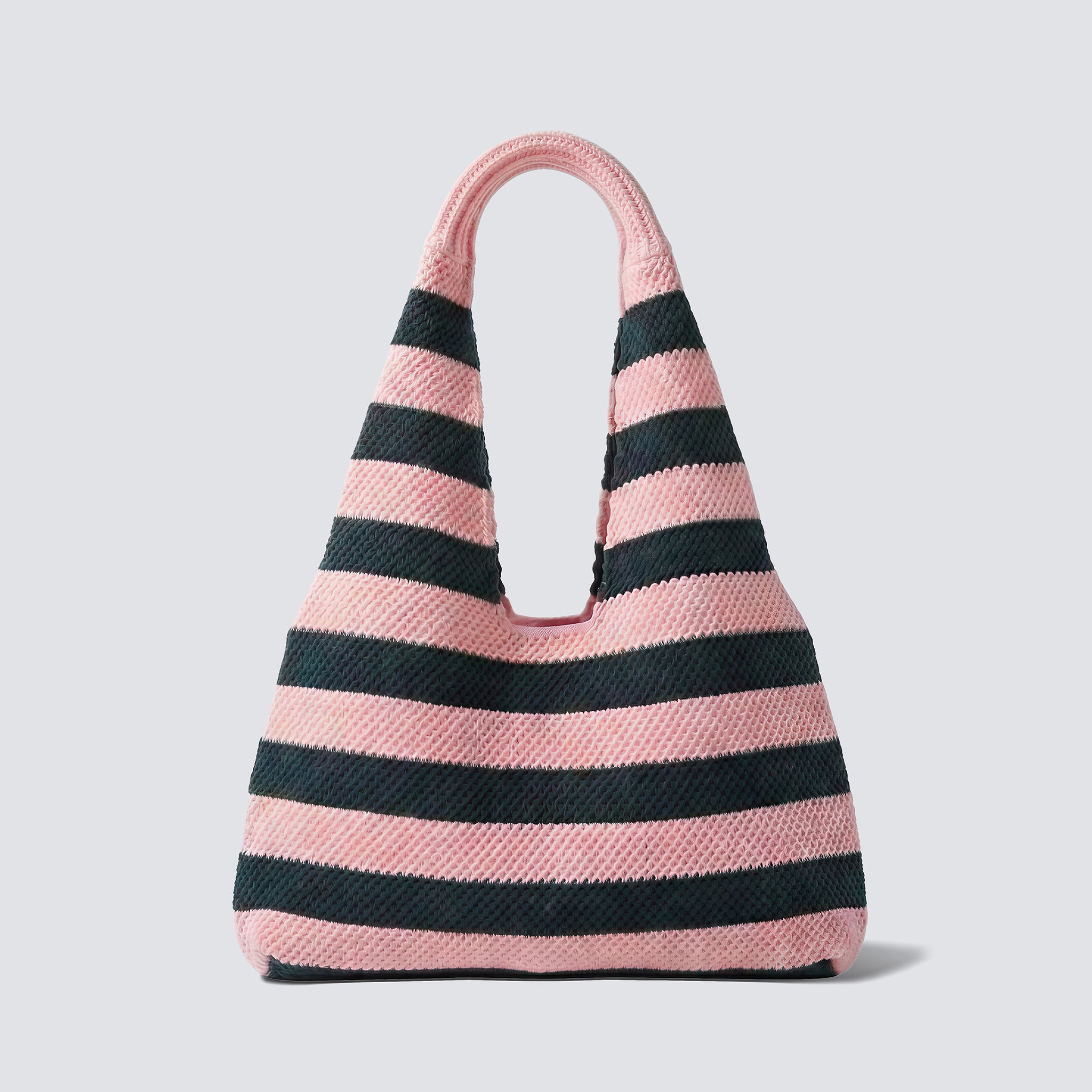Pink and navy blue striped knit beach bag on a simple product background