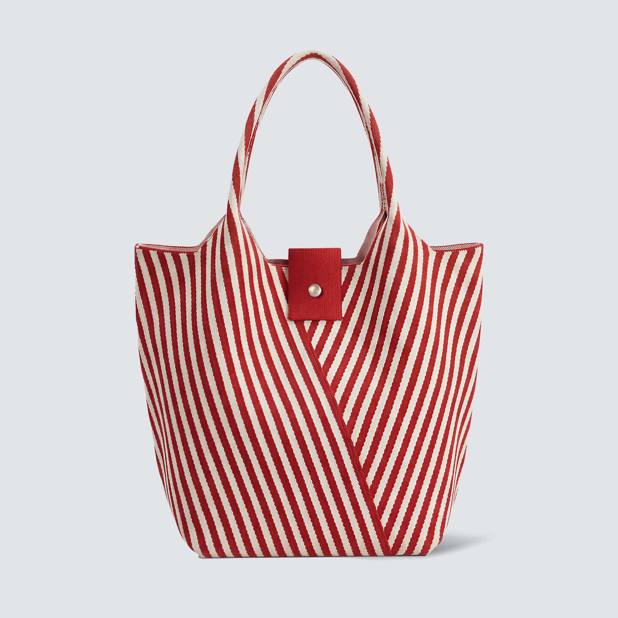 Red and white striped knit summer tote bag on a simple product background