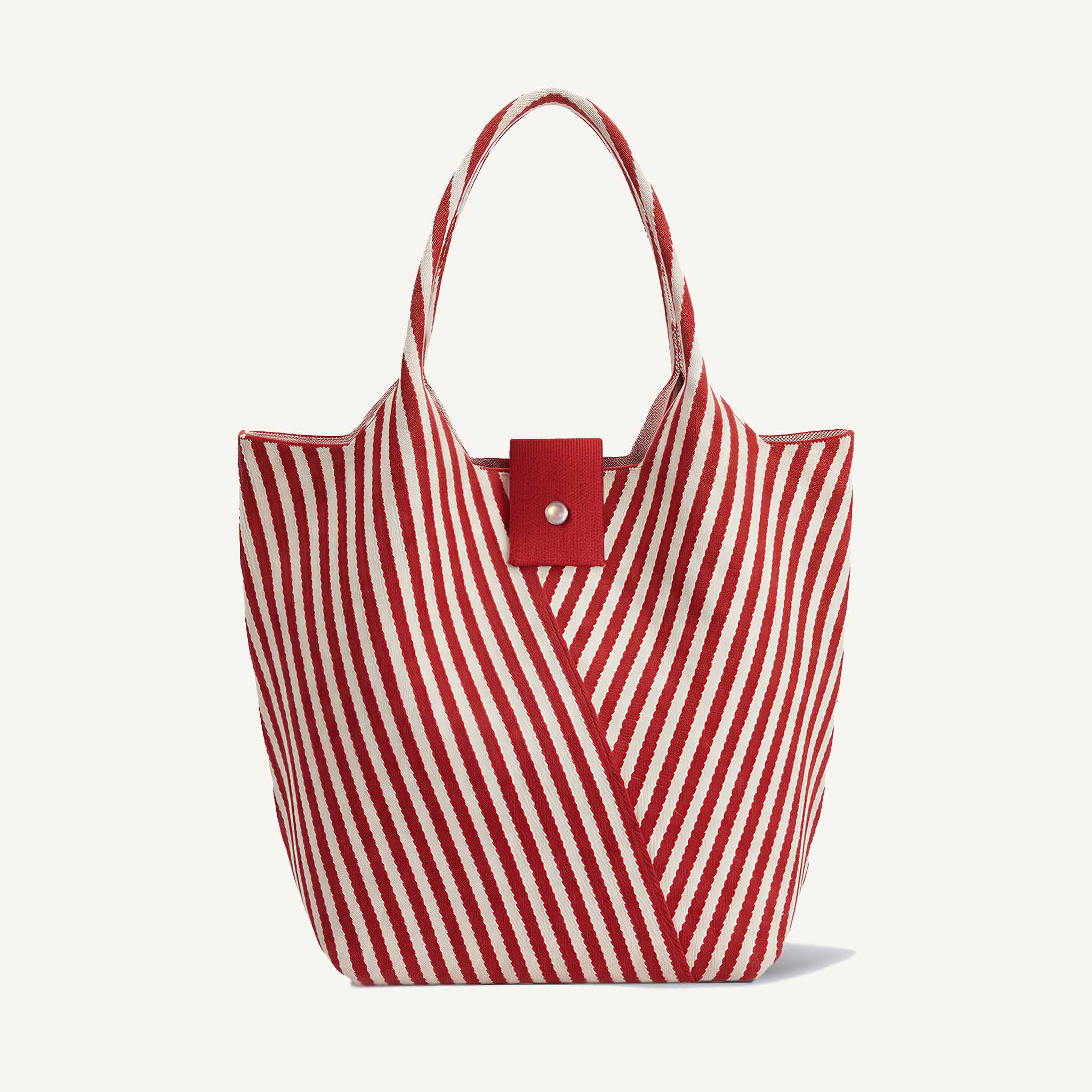 Red and white striped knit summer tote bag with snap closure, front view