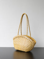 Soft yellow handwoven genuine leather tote bag angled view