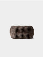 Bottom view of the brown artisan woven genuine leather handbag, showing its solid and structured base.