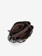Open woven vegan leather bucket bag showing roomy interior compartments and inner pocket