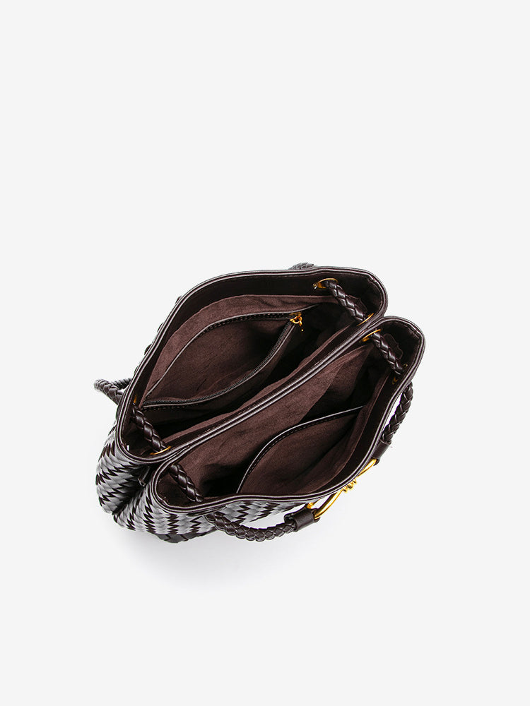 Open woven vegan leather bucket bag showing roomy interior compartments and inner pocket