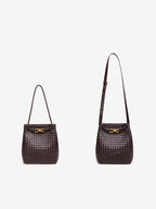 Woven vegan leather bucket bag shown with short shoulder strap and long crossbody strap options