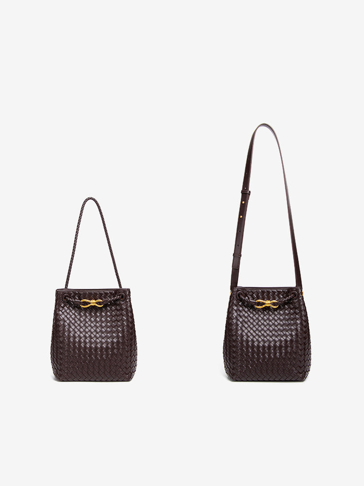 Woven vegan leather bucket bag shown with short shoulder strap and long crossbody strap options