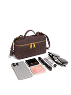 Compact woven vegan leather crossbody bag shown with phone sunglasses makeup and daily essentials