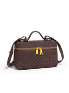 Angled view of chocolate brown woven vegan leather crossbody bag with detachable shoulder strap